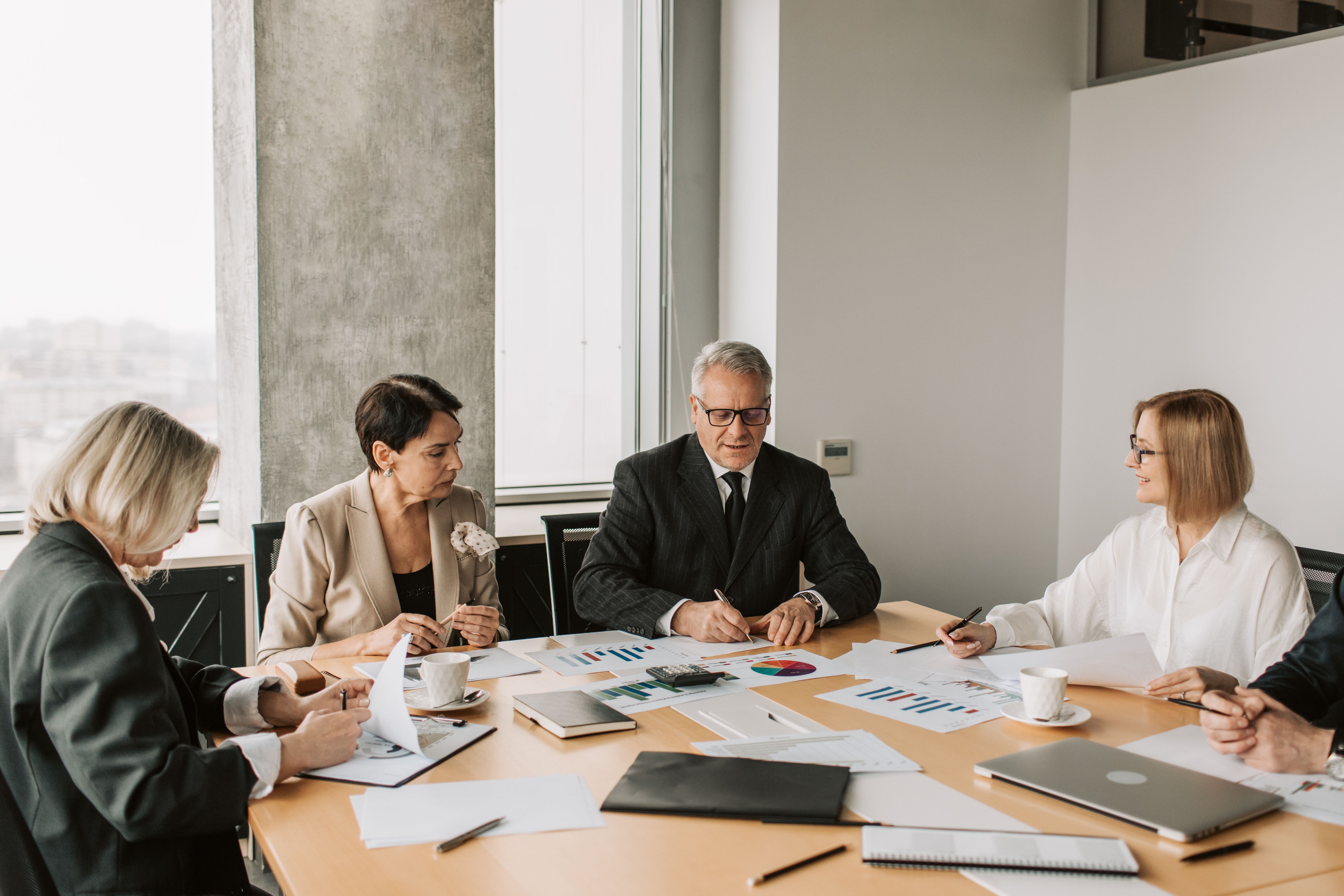 a group of mediators sitting at a conference table together