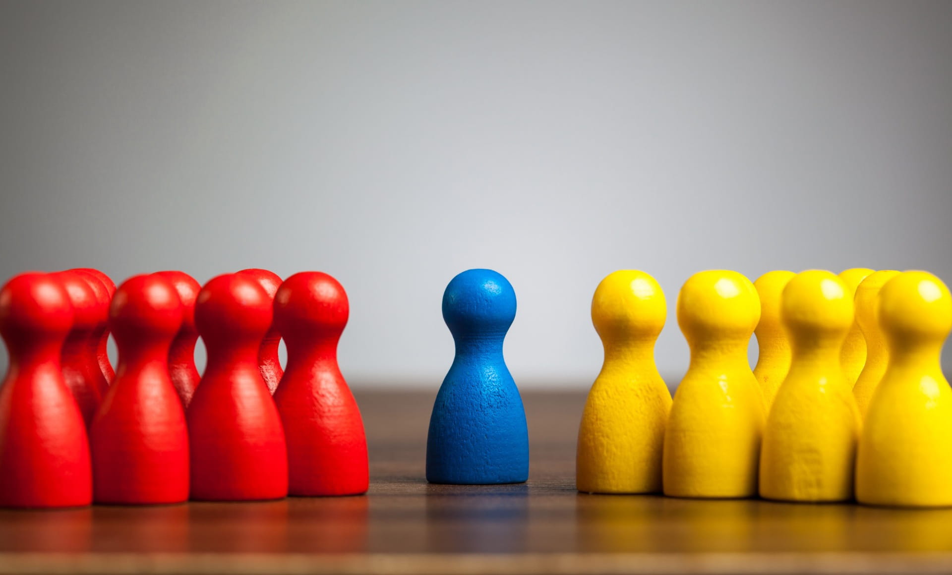 Red, blue, and yellow game pieces representing the rules and fairness of arbitration